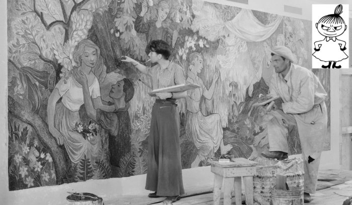 A woman is painting part of a large painting showing people at a picnic, while a man looks on. To one side of the photo, there is an ink drawing of a small female character with her hands on her hips.